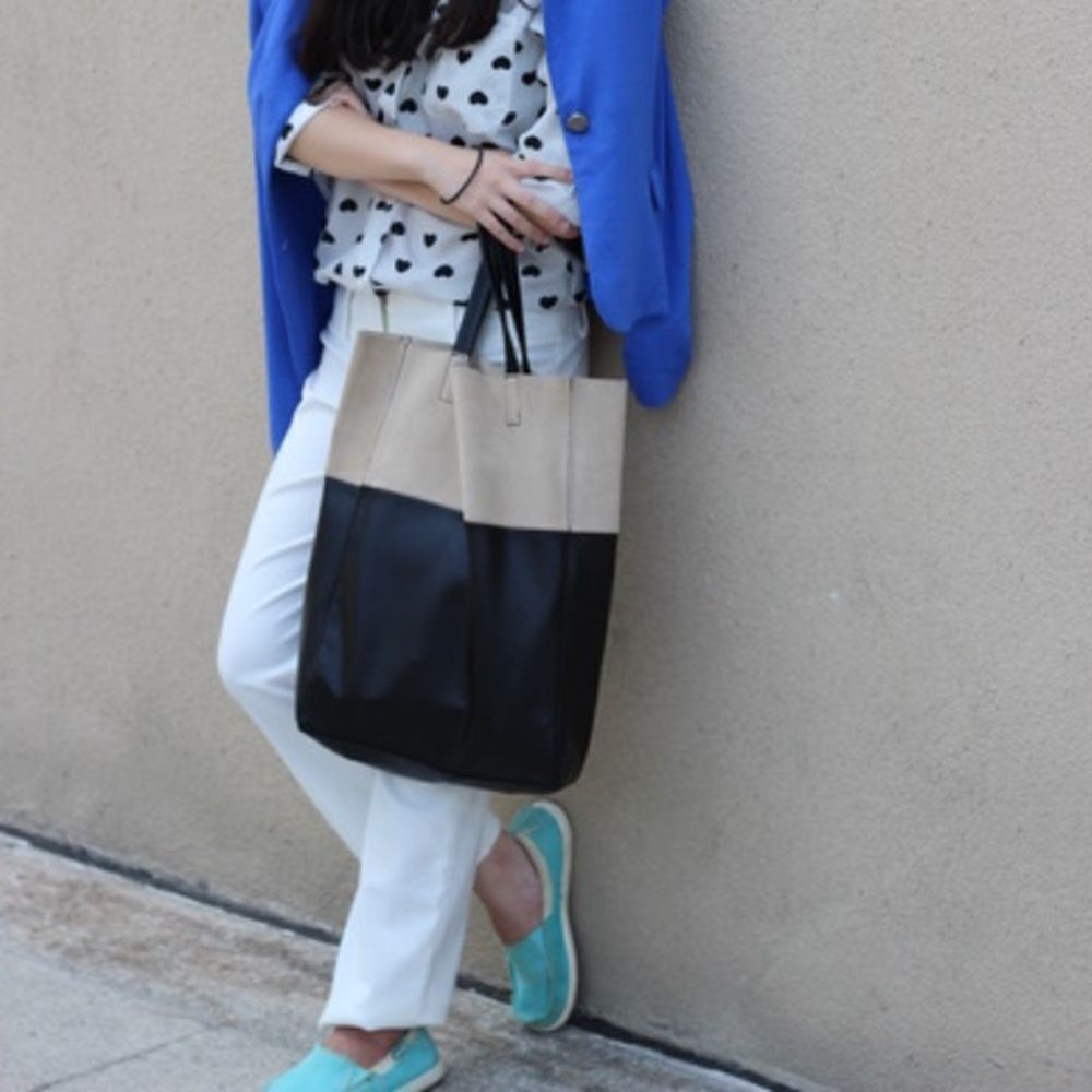 Soft, color-block Shopper Tote with concealed magnetic fastener at top. Unlined.